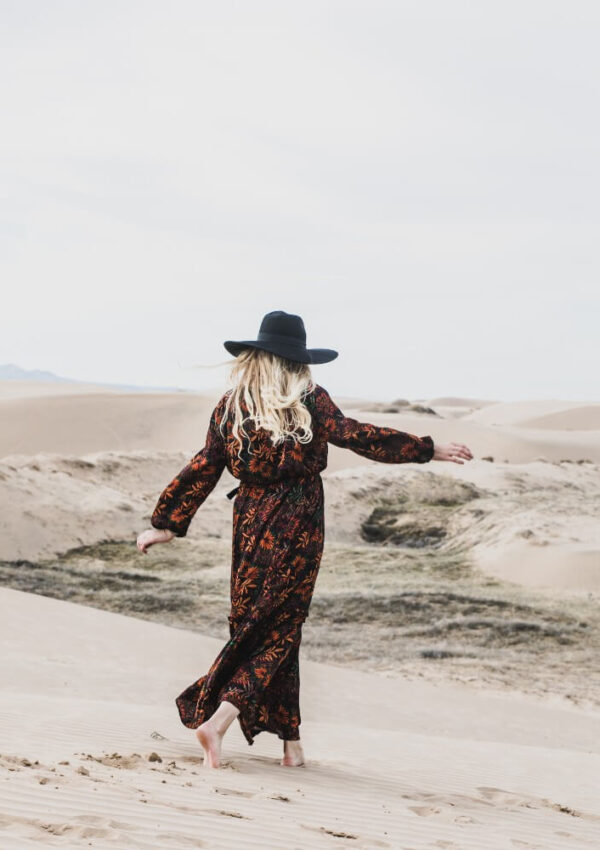 maxi dress wearing woman on beach