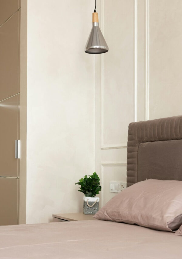 beige bedding and walls