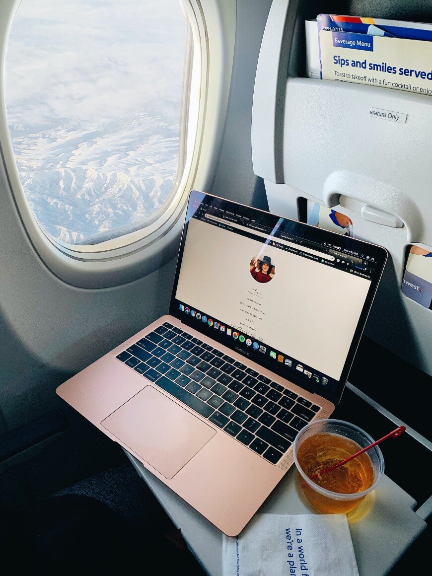 laptop and plane window