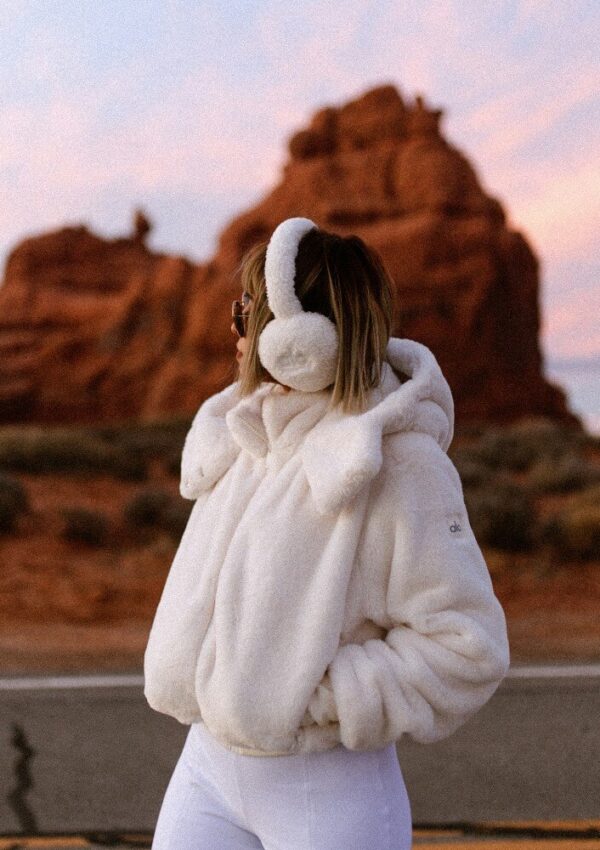 white jacket and earmuffs