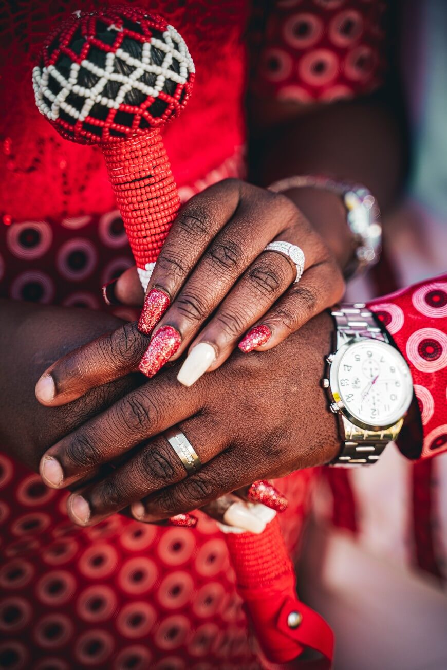 red glitter nails with white accent