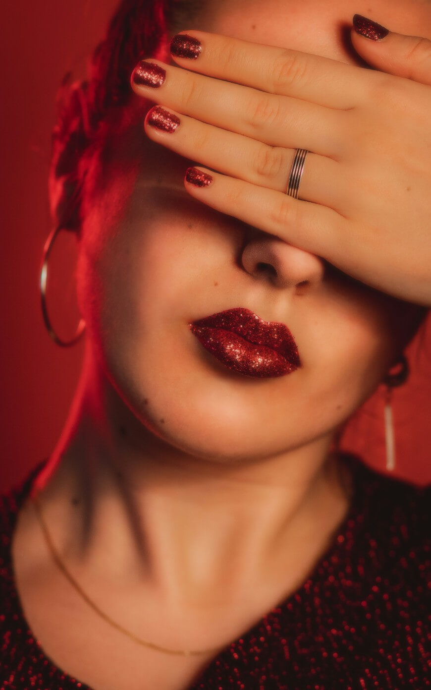red glitter nails and lipstick