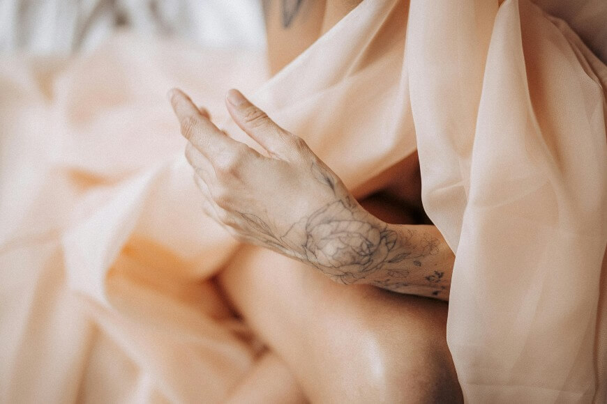 cute fine line tattoo of a flower