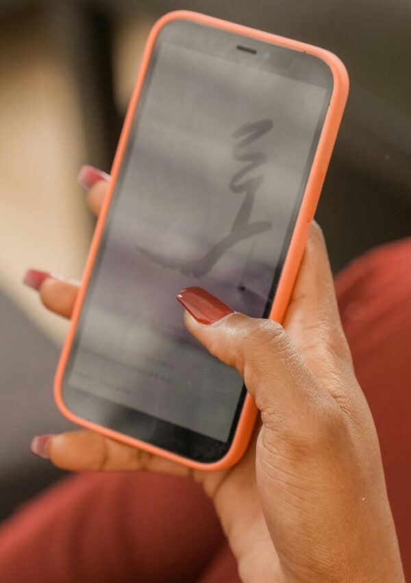 woman with orange nails