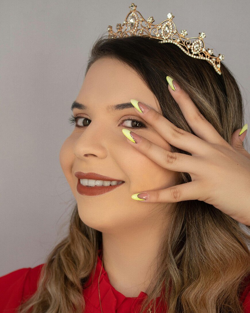 woman with neon yellow nails