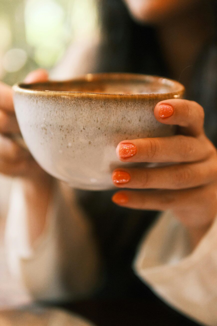 short orange nails with glitter