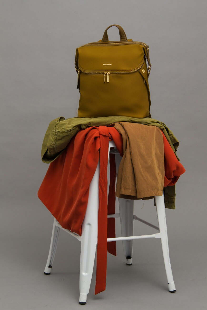 clothes piled on stool