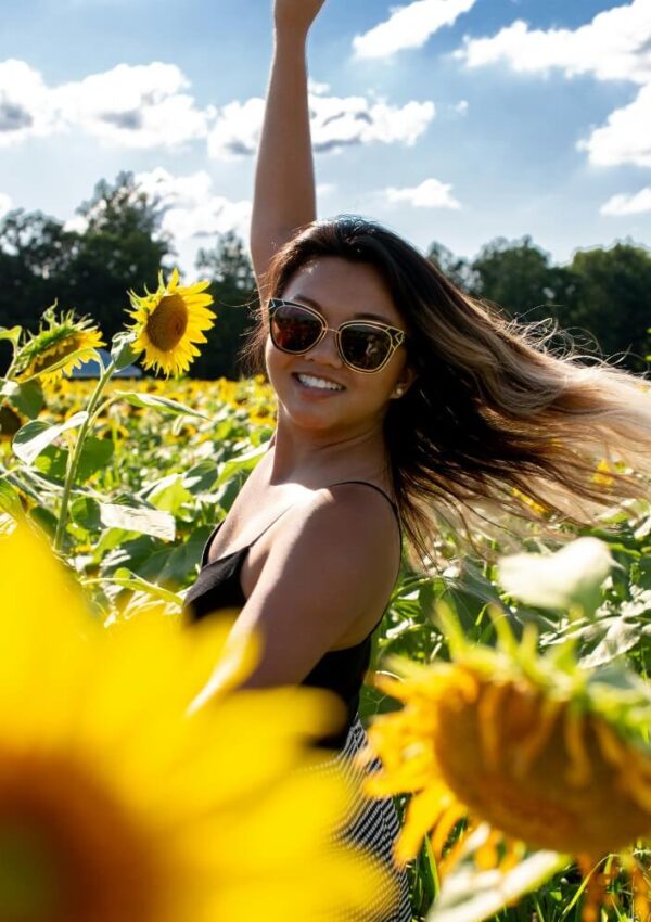 girl in summer sunflower field