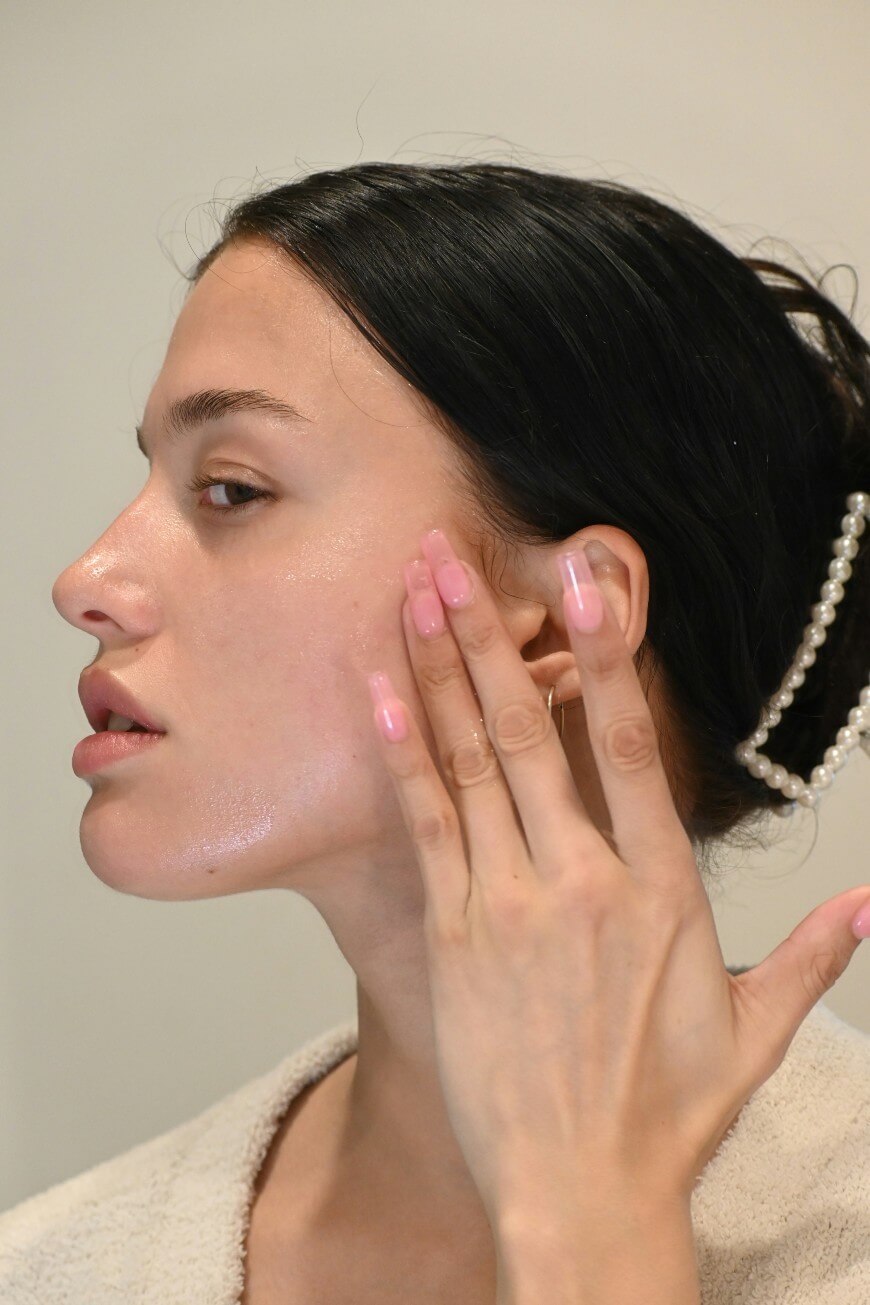 woman applying skincare