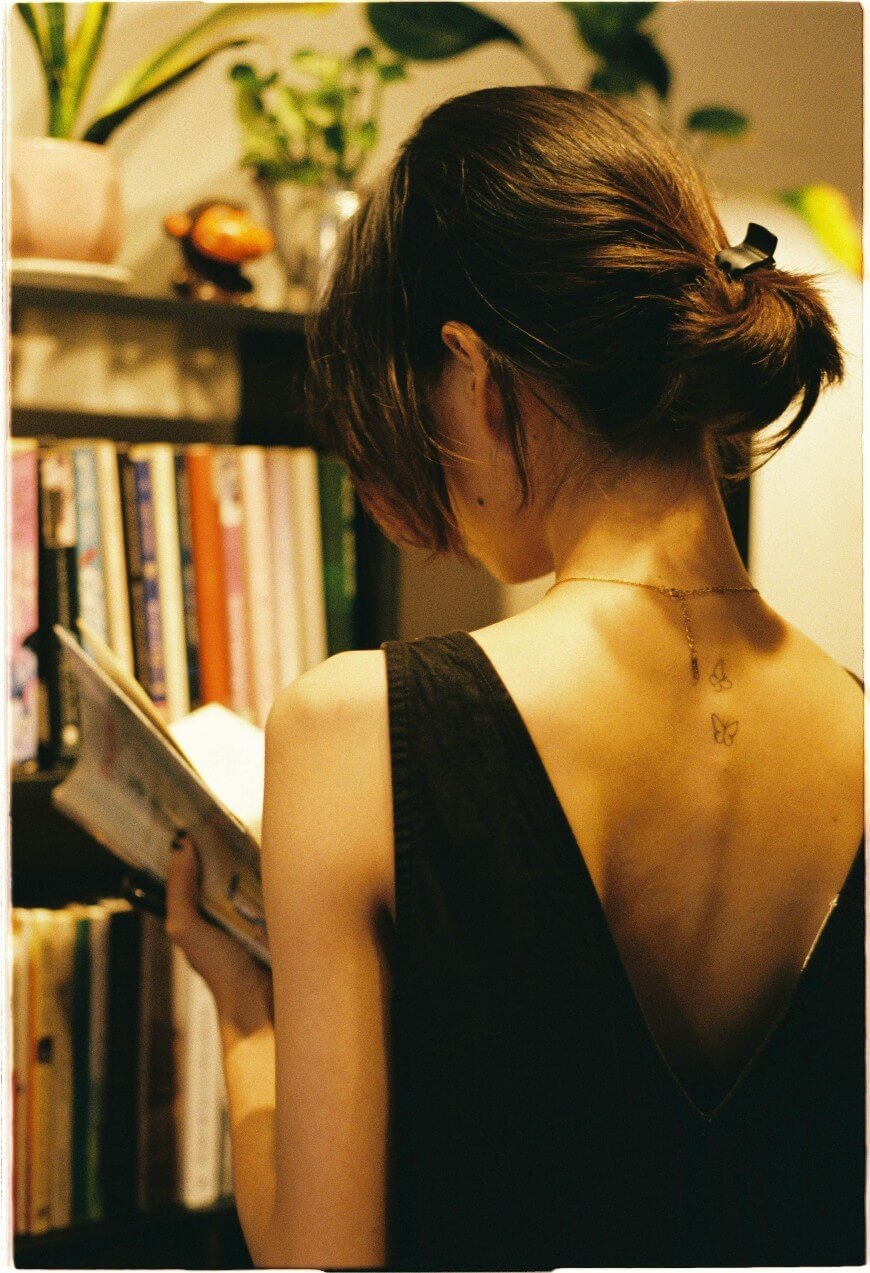 back tattoo of little butterflies