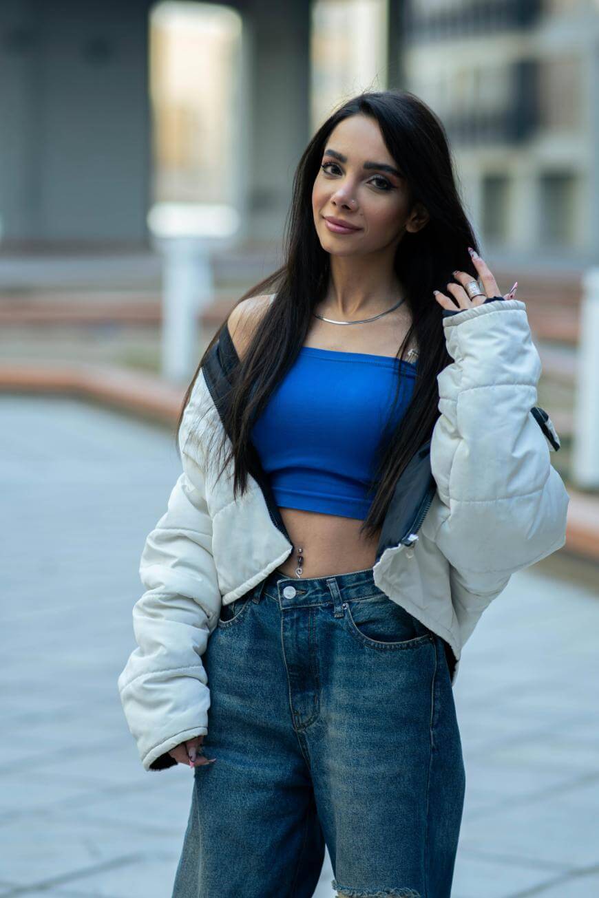 A woman posing for a picture.