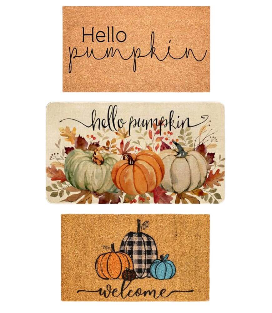 Three doormats: Top—light brown with Hello pumpkin in script; Middle—autumn leaves, three pumpkins, and hello pumpkin; Bottom—three pumpkins (one plaid), and welcome in script.