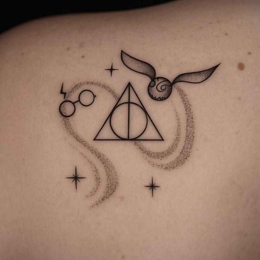 A tattoo on skin featuring Harry Potter-themed symbols: glasses with a lightning bolt, the Deathly Hallows symbol, a flying Golden Snitch, and several small stars, all drawn with fine black lines.