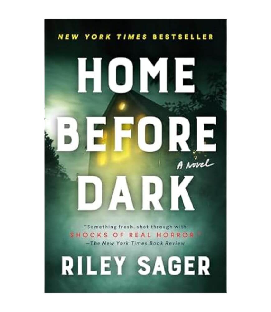 Book cover for Home Before Dark by Riley Sager, featuring a dark house with glowing windows surrounded by eerie green mist. The cover includes a quote praising the book as a New York Times bestseller.