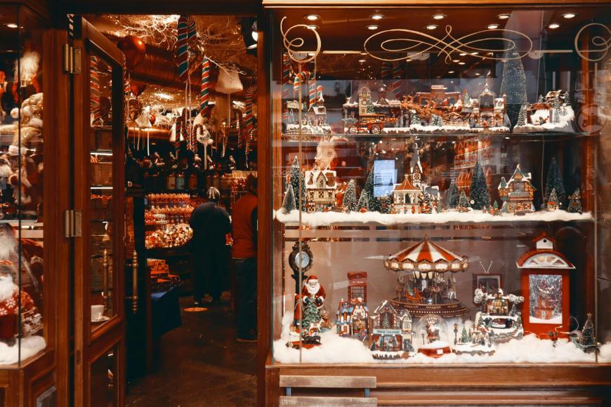 A storefront with a display of christmas decorations.