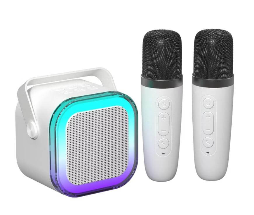 A white wireless speaker with a handle and glowing LED trim is next to two matching white wireless microphones with black mesh tops and control buttons on their bodies, all on a white background.