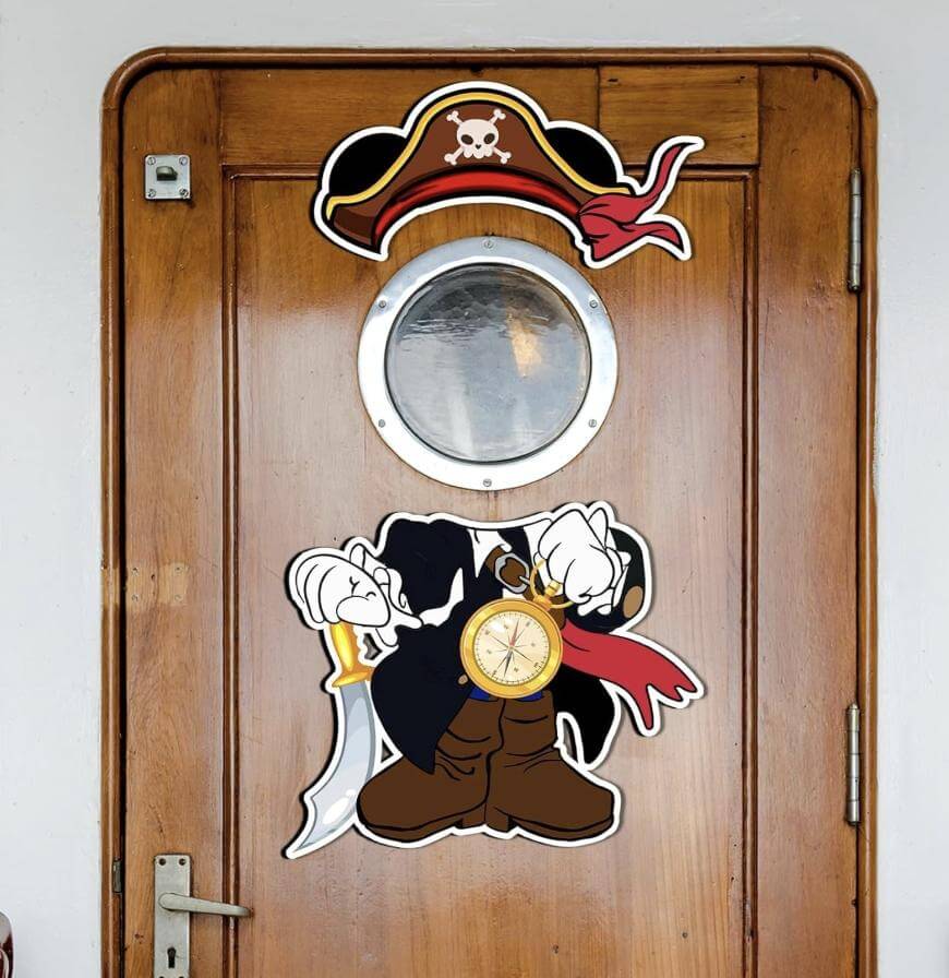 A wooden door with a round porthole window featuring a cartoon pirate decal; the pirate holds a sword and a pocket watch, with his face positioned around the window, and a pirate hat and scarf above it.