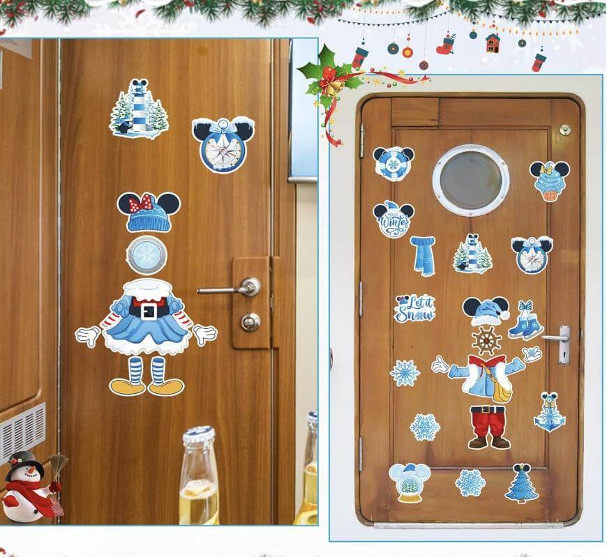 Two brown doors decorated with holiday-themed cartoon stickers, including a snowman, mittens, and mouse ears with bows. A garland with holly is at the top, and drinks and a penguin figurine are visible in the foreground.