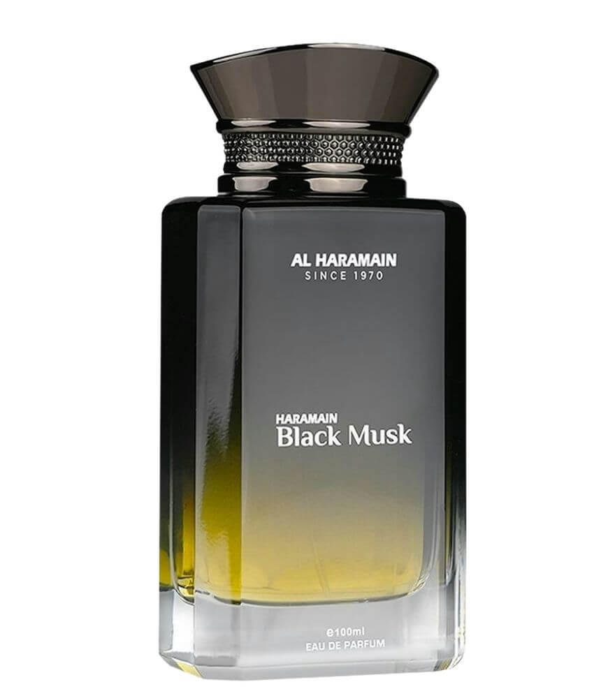 A rectangular glass bottle of Al Haramain Black Musk perfume with gradient black and yellow tones, a shiny black cap, and white text on the front displaying the brand and fragrance name.