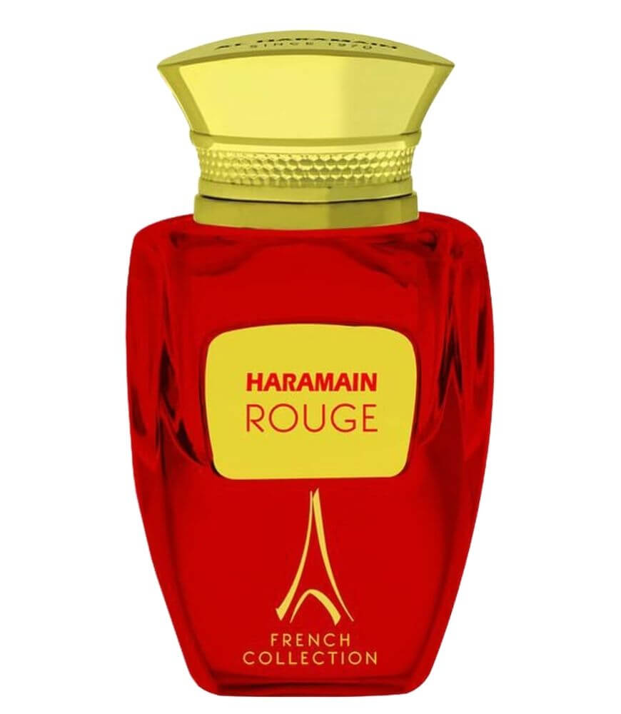 A red perfume bottle with a gold cap and yellow label displaying Haramain Rouge. The lower part of the bottle reads French Collection with a gold decorative design.