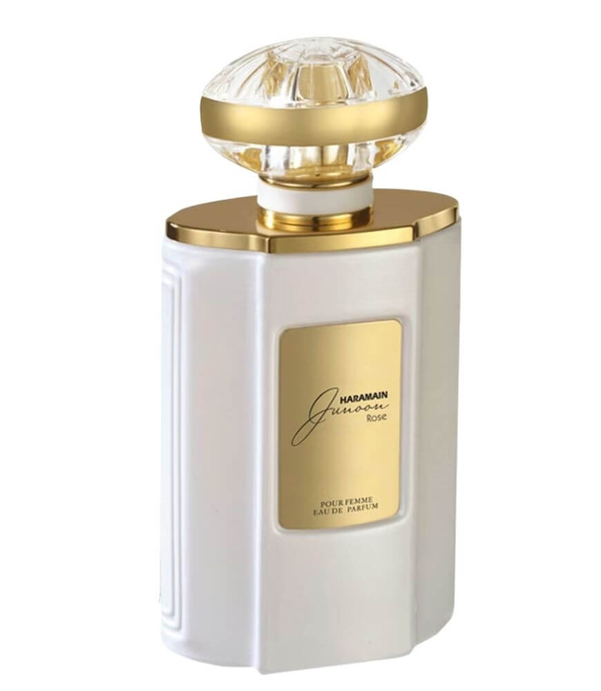 A white and gold perfume bottle with a faceted, clear cap. The gold label on the front reads Haramain Junoon Rose Pour Femme Eau De Parfum. The design is elegant and luxurious.