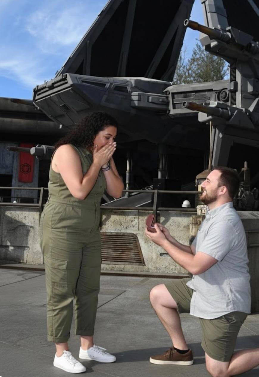 A man proposing to a woman.