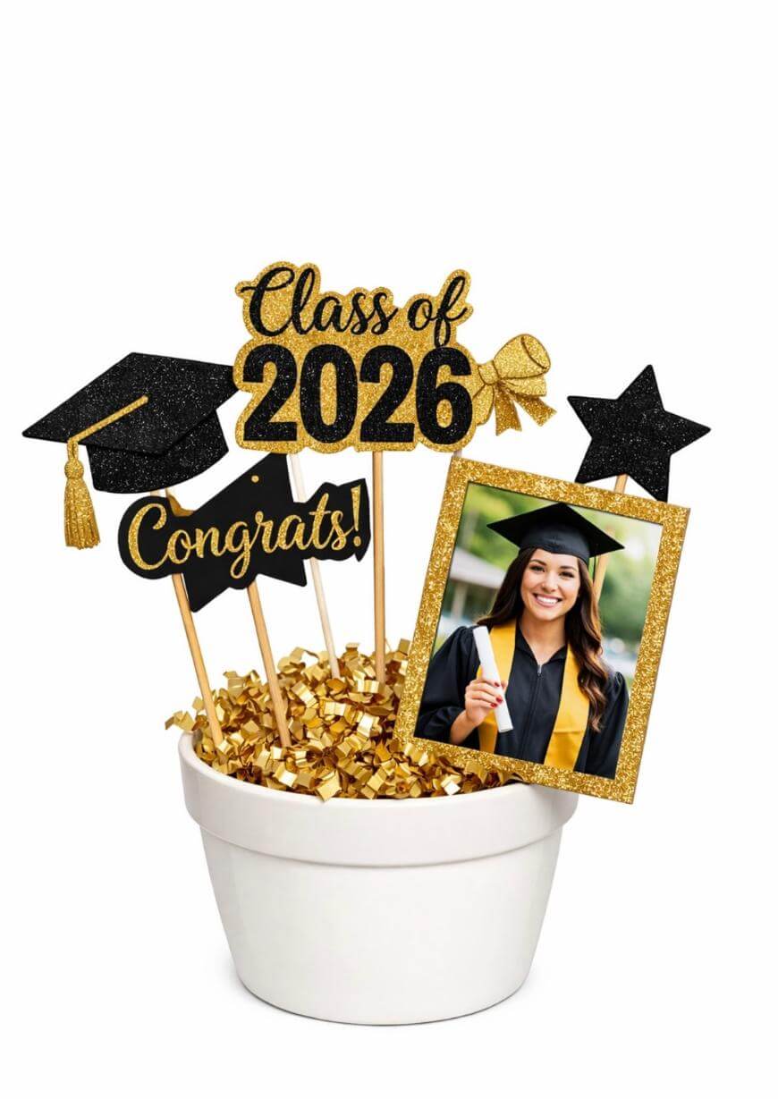 A white pot filled with gold confetti holds decorative sticks with a graduation cap, star, bow, Class of 2026, Congrats!, and a photo of a smiling graduate in a cap and gown.