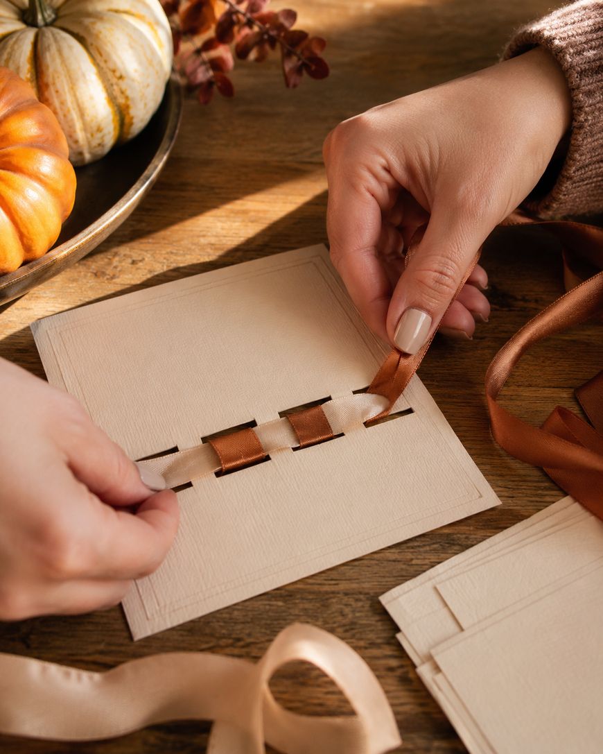 Weaving ribbon through a cardstock place card